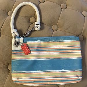 Coach striped wristlet with rope handle. 9.5” x 6.5”